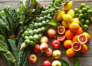 a group of fruits and vegetables on a wood surface Healthy Weight Loss Diets Stockport